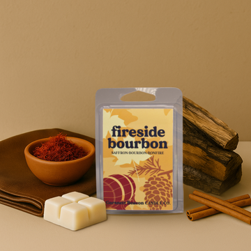 Fireside bourbon wax melt packaging with saffron, cinnamon sticks, and wood on a beige background