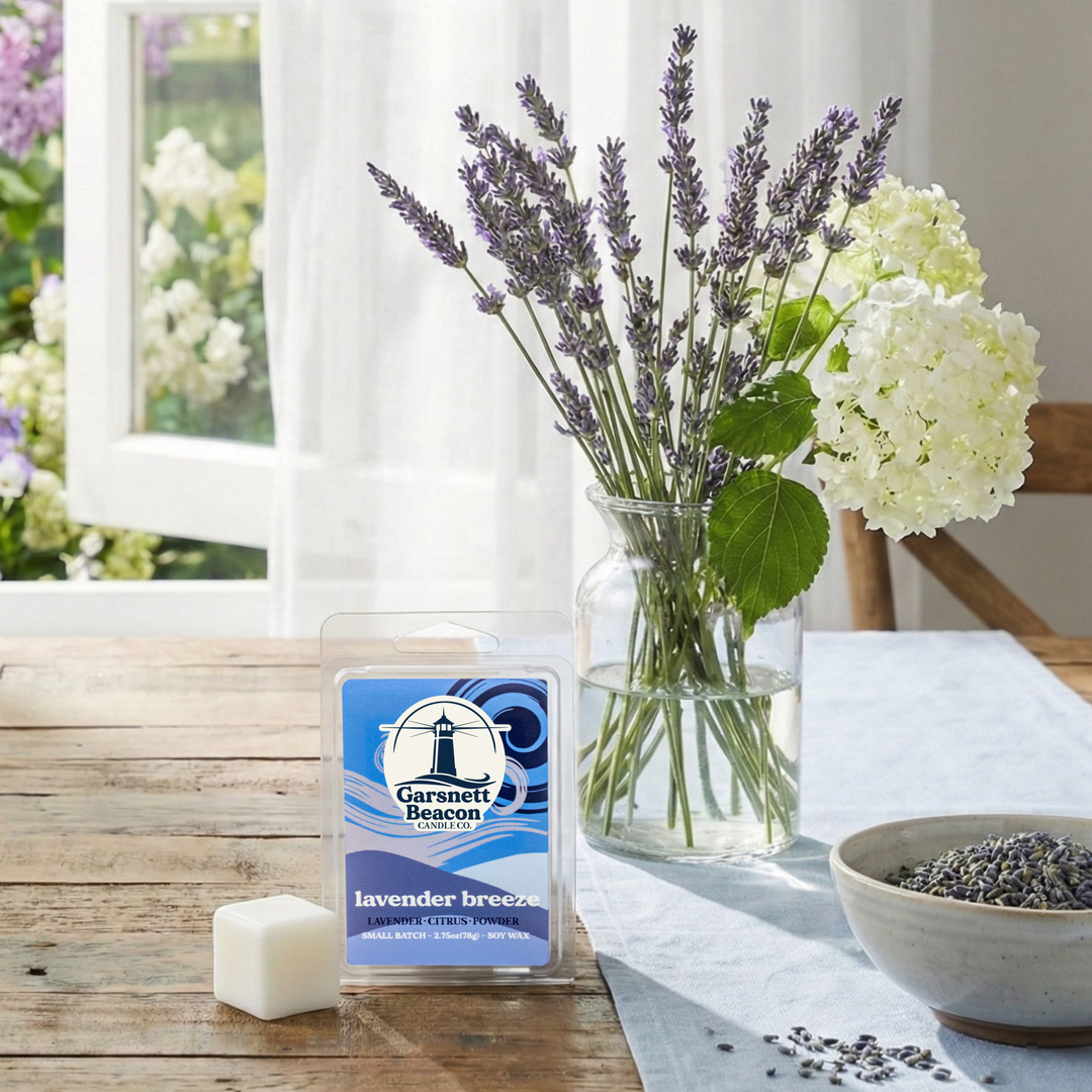 Wax melt labeled 'Lavender Breeze' on a table with flowers and lavender petals.