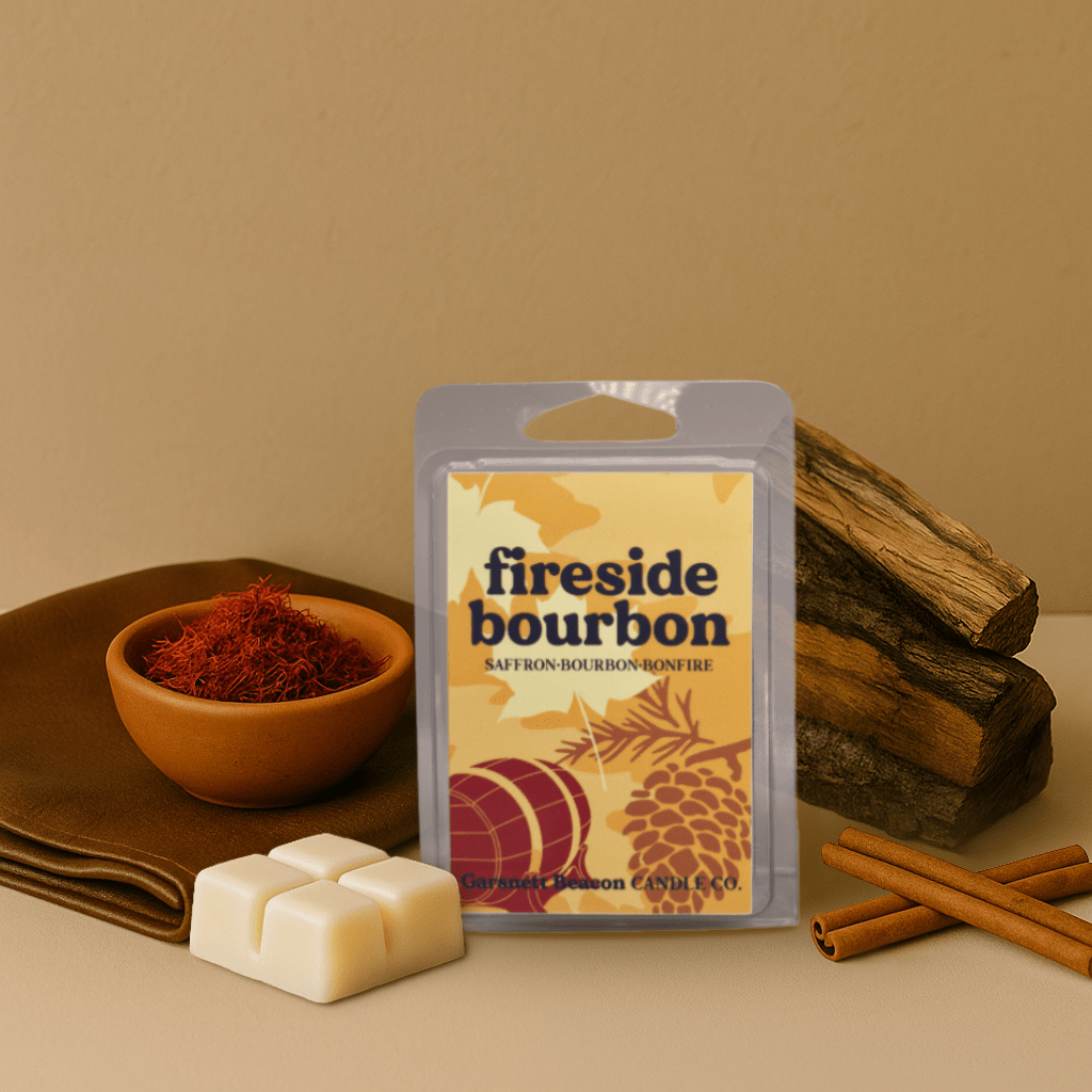 Fireside bourbon wax melt packaging with saffron, cinnamon sticks, and wood on a beige background