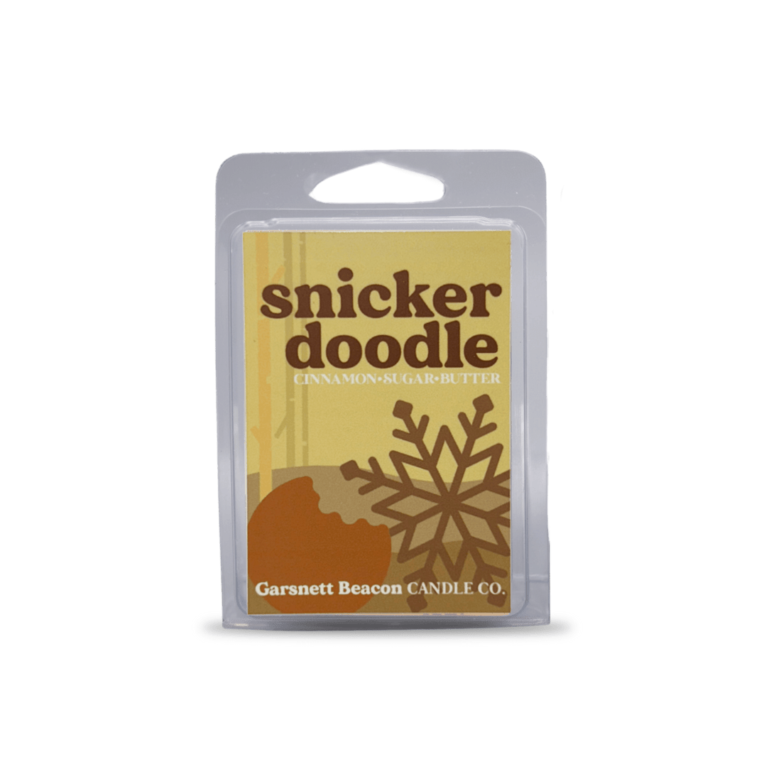 Snickerdoodle-themed wax melt with cookies, cinnamon, and a wax bar on a light blue background
