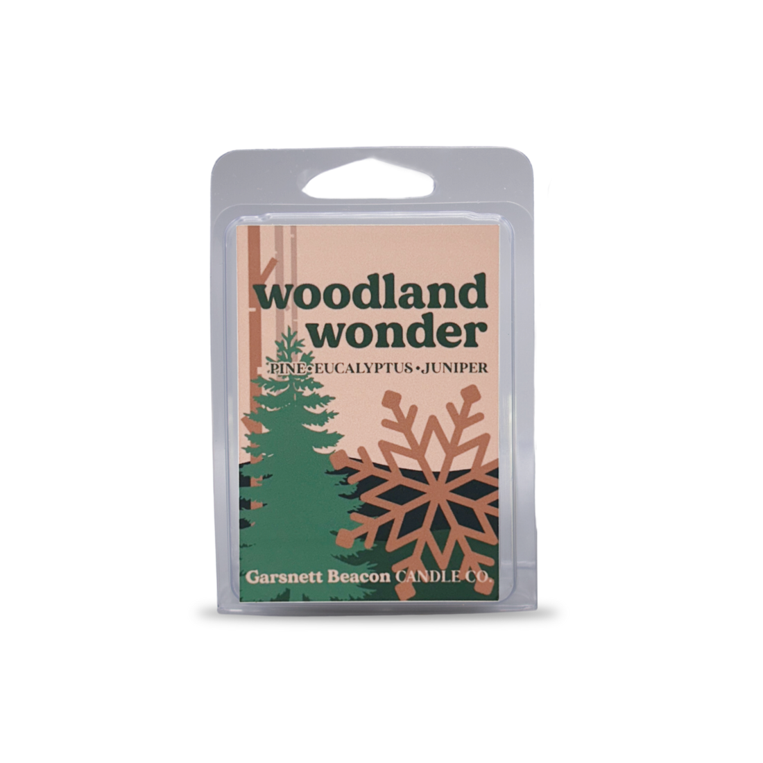 Woodland Wonder wax melt packaging with a white wax melt on a light blue background
